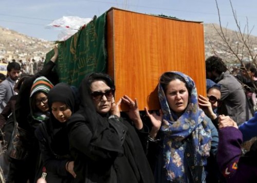 Afghan women's rights activists carry the coffin of Farkhunda, an Afghan woman who was beaten to death and set alight on fire on Thursday, during her funeral ceremony in Kabul March 22, 2015.