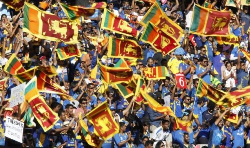 Fans of Sri Lanka's World Cup cricket team cheer on their batsmen during their Cricket World Cup match against Bangladesh at the MCG in Melbourne, February 26, 2015. 