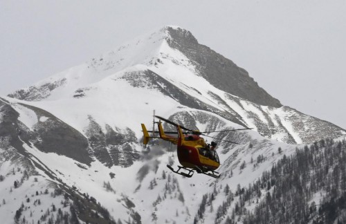 A rescue helicopter from the French Securite Civile flies over the French Alps during a rescue operation after the crash of an Airbus A320, near Seyne-les-Alpes, March 24, 2015.