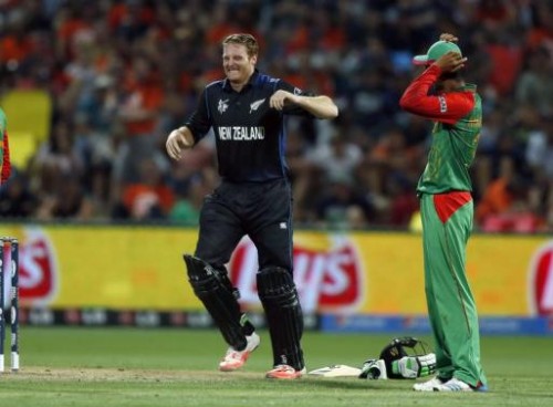 New Zealand's Martin Guptill grimaces with cramp just before making a century. –Reuters 