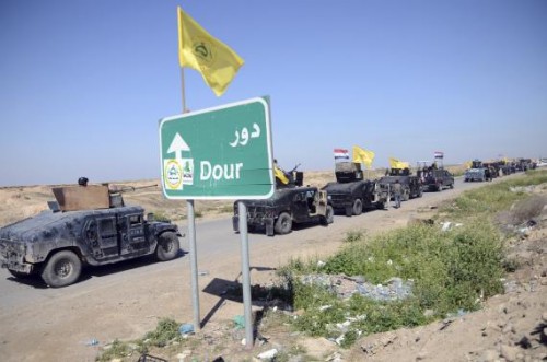 Members of Iraqi security forces and Shiite militia fighters make their way in vehicles from Samarra to the outskirts of Tikrit, north of Baghdad, February 28, 2015.