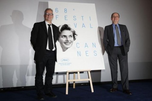 Cannes Film festival general delegate Thierry Fremaux (L) and its president Pierre Lescure pose near this year's poster after a news conference to announce the competing films at the 68th Cannes Film Festival in Paris April 16, 2015.