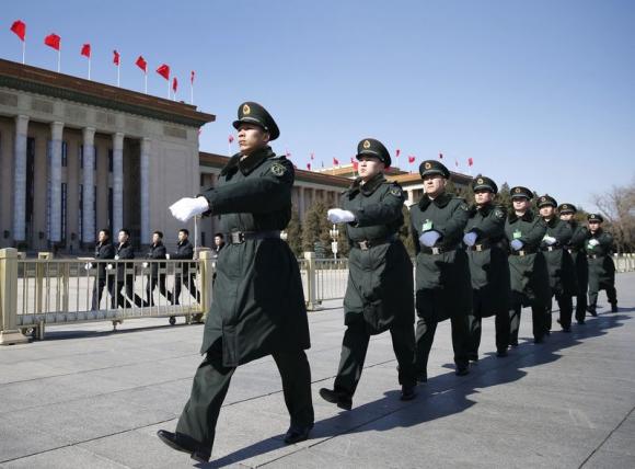 China defence budget rise to defy slowing economy