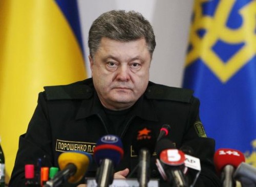 Ukraine's President Petro Poroshenko talks to military staff in Kiev February 14, 2015. REUTERS