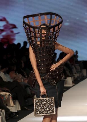 A model presents creations by Pakistani student designers Rimsha Shakir, Shehza Azhar, Hasan Riaz and Momal Zia, during the Fashion Pakistan Week (FPW) in Karachi March 31, 2015. Reuters