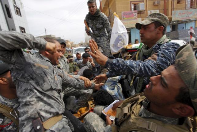 After Iraqi forces take Tikrit, a wave of looting and lynching