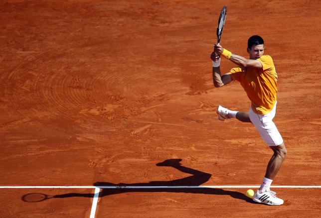Djokovic slides smoothly through in Monte Carlo