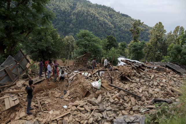 Near remote Nepal quake epicentre, survivors dig for loved ones alone