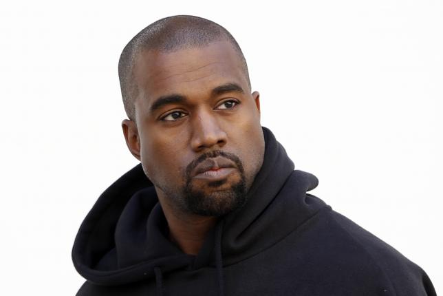 Rapper Kanye West settles lawsuit with photographer over scuffle