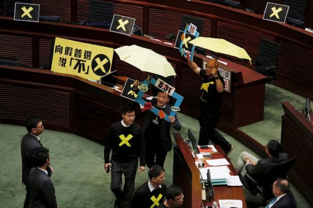 Hong Kong unveils electoral reform package, vows no compromise