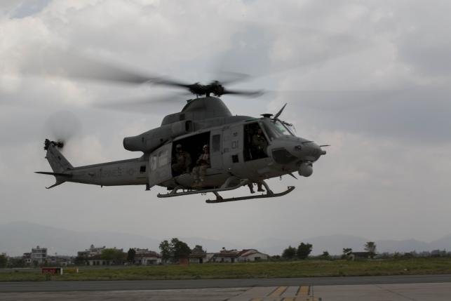 Choppers and drone hunt for missing US Huey, Nepal quake toll rises