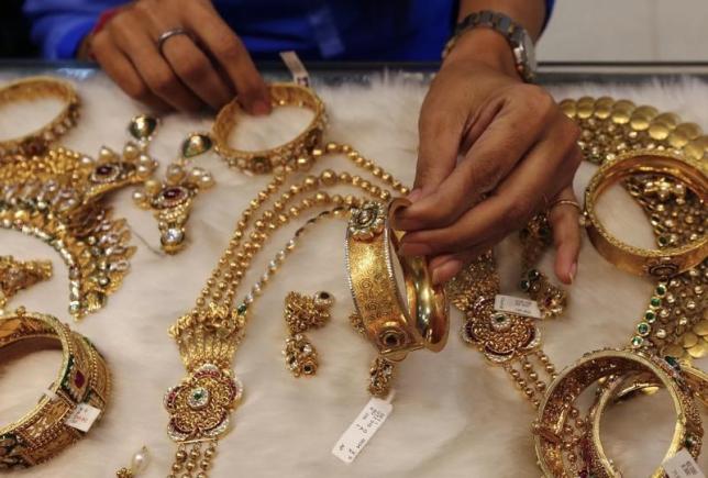 Gold near three-month high; eyes weekly gain on US rate expectations