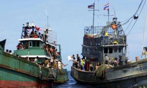 Migrants land in Indonesia, but hundreds pushed back to sea