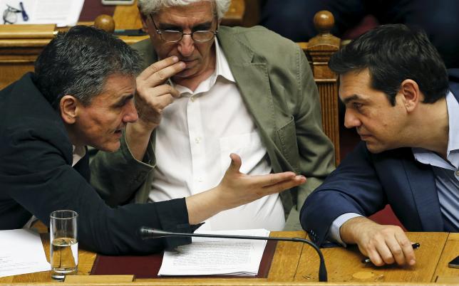 Laws passed, Greece to open bailout talks as recession pushes goals further