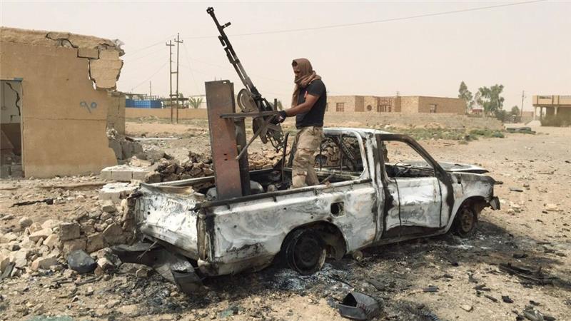 Iraqis launch offensive near Anbar base as blasts kill 32