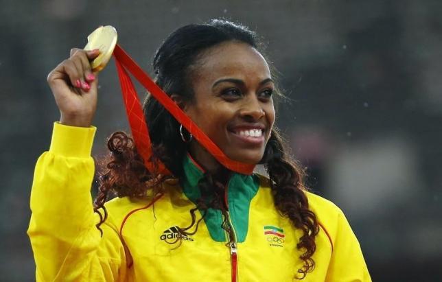 Dibaba and Kiprop coast, holder Reese out of long jump