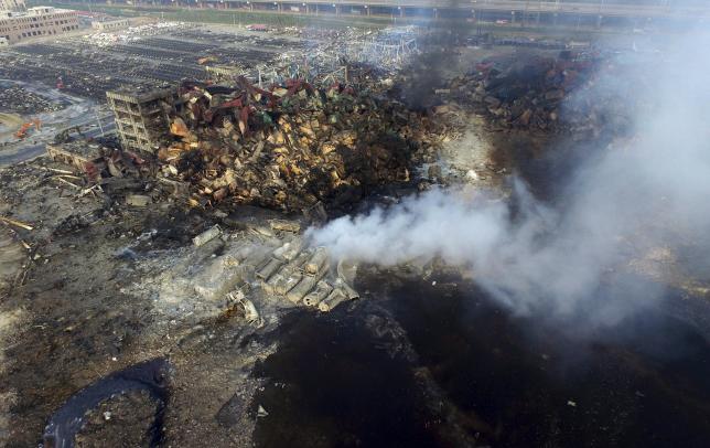 Rescuers work to clear China blast site of chemicals before rain falls