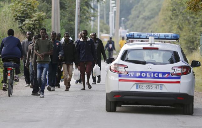France and Britain target traffickers in migrant policing push
