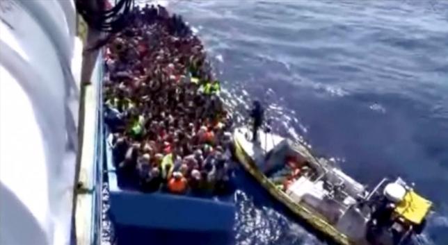 Boat packed with migrants sinks off Libya; up to 200 feared dead