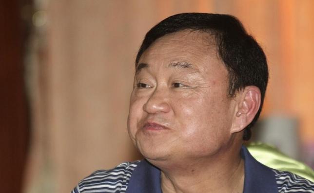 Fugitive ex-Thai PM Thaksin warns on economy