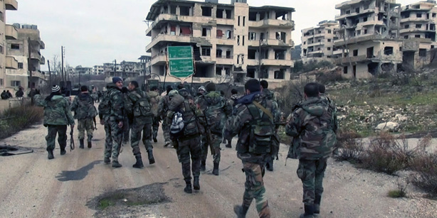 Syrian pro-government forces retake key town in west ahead of planned talks