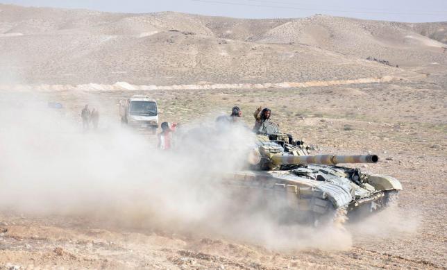 Syrian army pushes into Palmyra amid heavy bombardment