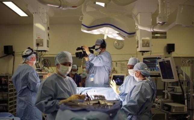 Less-invasive heart valve implant outperforms surgery in study