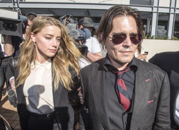 Johnny Depp's wife cops good behavior bond as Australia ends 'war on terrier'