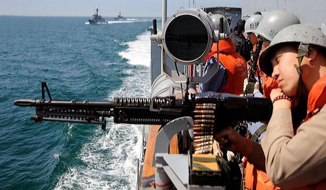 South Korea fires warning shots after boats from North cross sea border