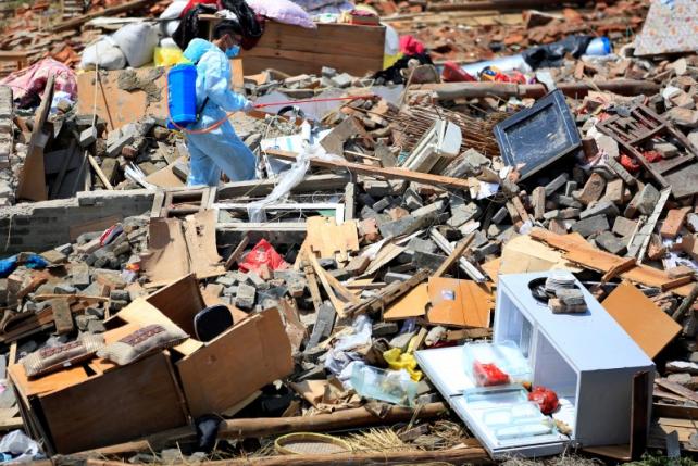 After deadly China tornado, rescuers clean up hazardous chemicals
