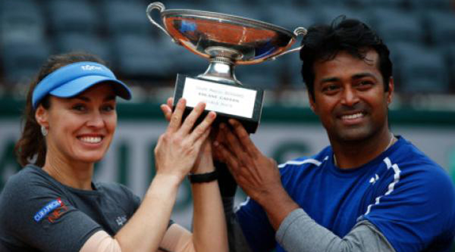 Paes, Hingis complete full set of doubles titles with French win