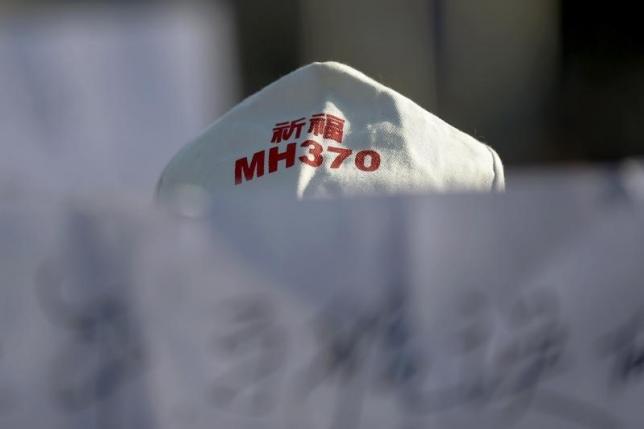 Rough seas, high winds delay search for Flight MH370