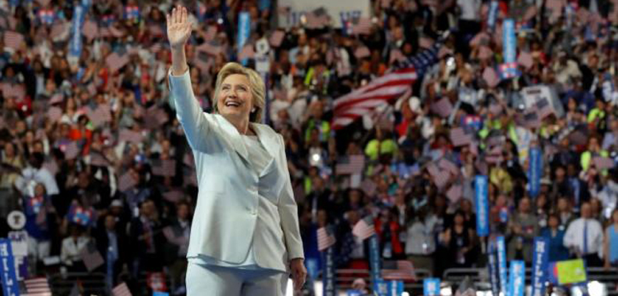 Accepting the nomination, Clinton casts herself as clear-eyed leader