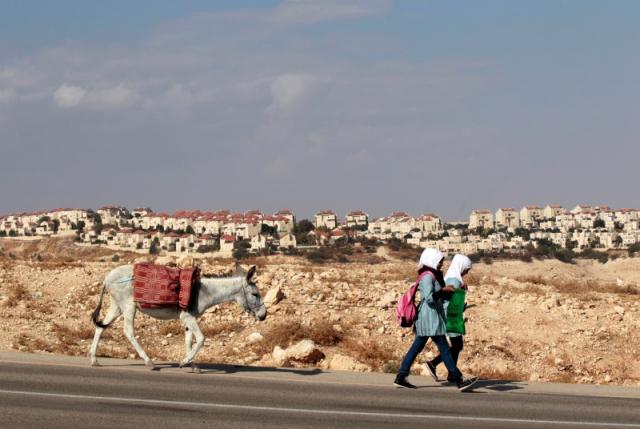 Israel should stop settlements, denying Palestinian development