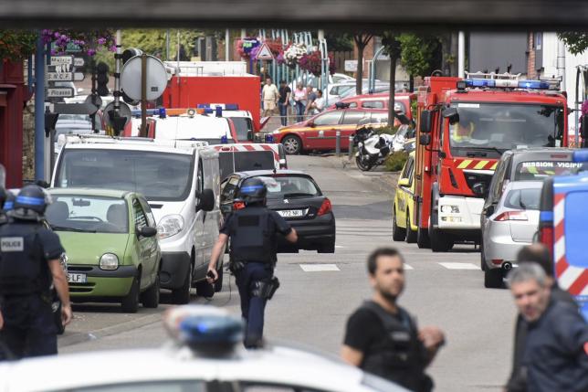 Priest killed in French church before police shoot dead hostage-takers