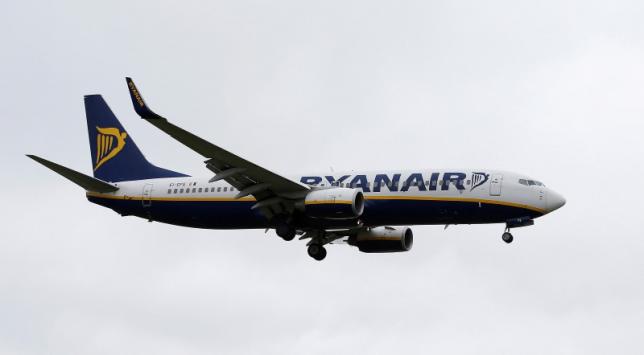 Ryanair says on track for record profit, but Brexit risks linger