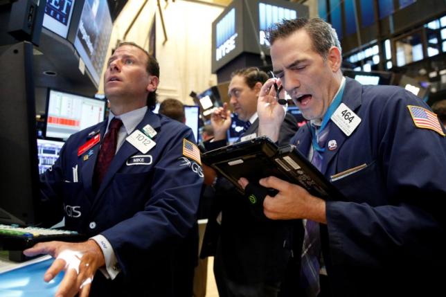 Oil majors drag down S&P, Dow; tech stocks boost Nasdaq