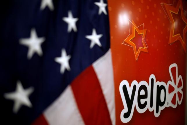 Yelp swings to surprise profit, raises full-year revenue forecast