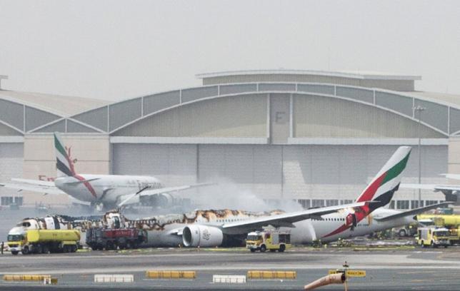 Fire guts Emirates jet after hard landing; one firefighter dies