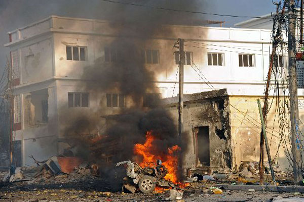 Twin suicide bombs claimed by al Shabaab kill 20 people in Somalia