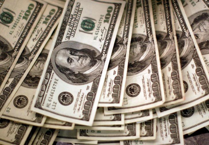 Dollar set for weekly loss as markets cool before BOJ, Fed