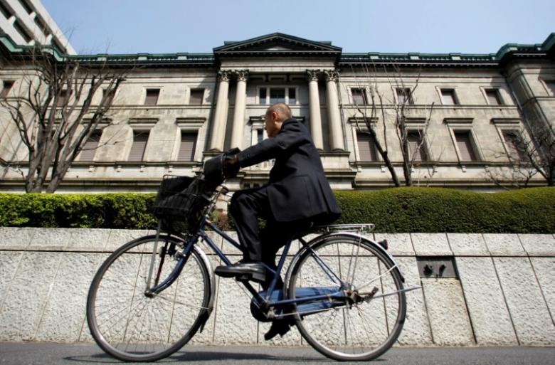 BOJ keeps policy steady, cuts price forecast