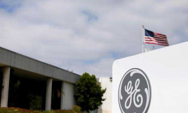 GE cuts year revenue target on oil, gas weakness, has third-quarter profit beat