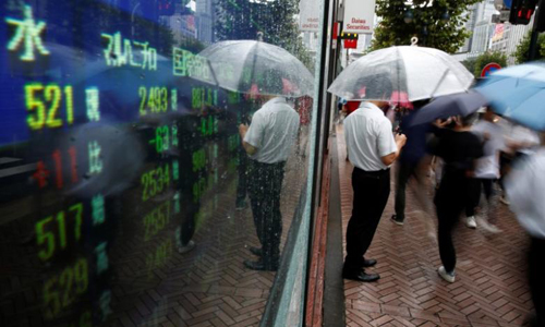 Asian shares rise as US interest rates ease, China steps up yuan defence