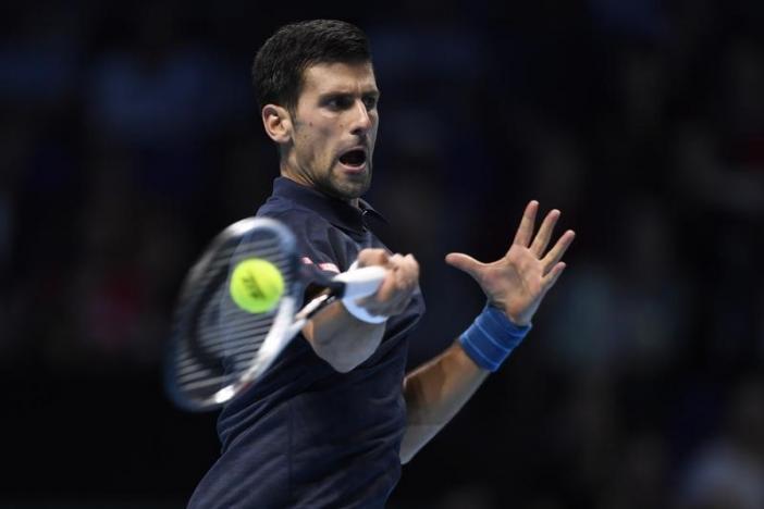 Djokovic digs deep to repel Raonic onslaught