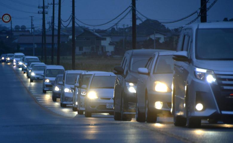 Tsunami hits Japan after strong quake, nuclear plant briefly disrupted