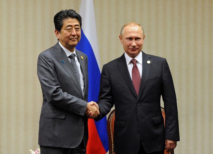 Abe, Putin to improve Japan-Russia ties but breakthrough on islands unlikely