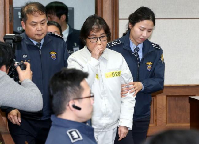 Friend of South Korea's Park denies charges as trial begins