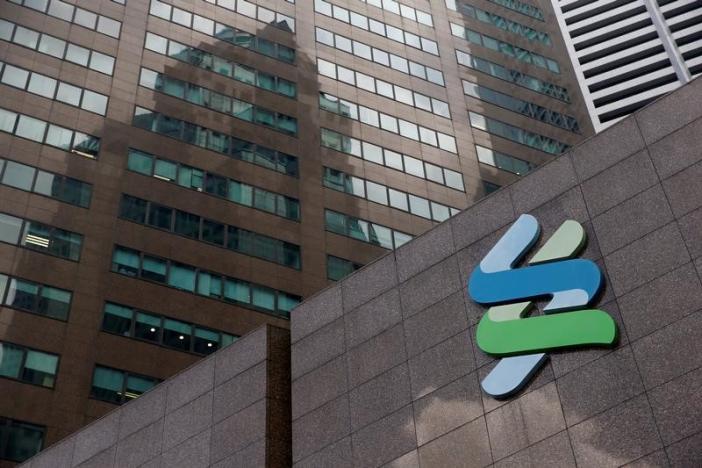 Singapore central bank slaps penalties on StanChart, Coutts in 1MDB-related probe