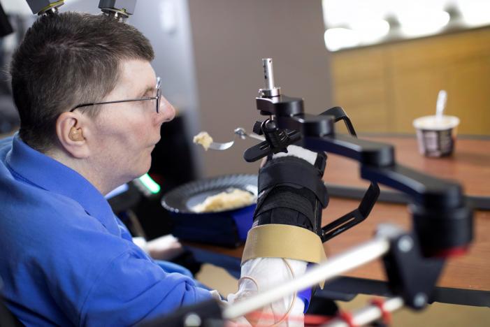 Brain implant lets paralyzed man feed himself using his thoughts